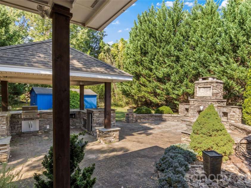 3103 Centennial Street, High Point, NC 27265.  MLS# CAR4426868, YatesRealty ID 52357. Rear Patio with fireplace