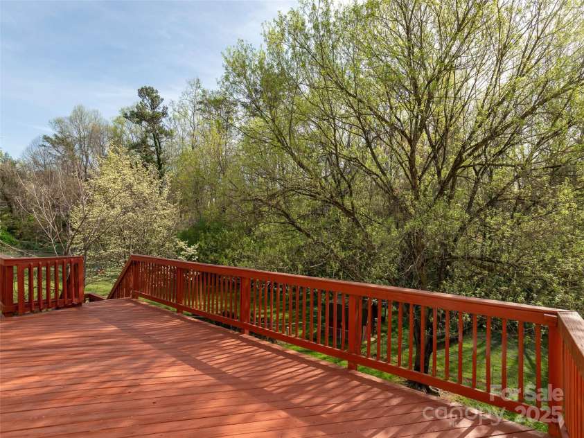 12 Birchwood Lane, Asheville, NC 28805.  MLS# CAR4244142, YatesRealty ID 5237. Deck leads down to the Yard