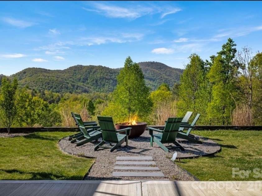 58 Bird Creek Estates Road, Black Mountain, NC 28711.  MLS# CAR4427379, YatesRealty ID 52383. Cozy up to the Fire Pit