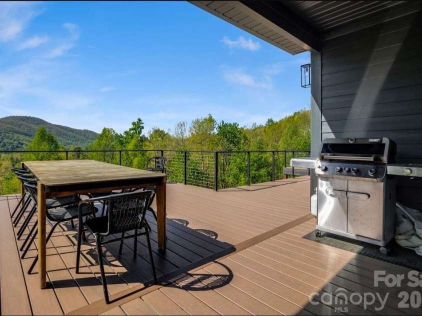 58 Bird Creek Estates Road, Black Mountain, NC 28711.  MLS# CAR4427379, YatesRealty ID 52383. Expansive Main Level Deck w Grill