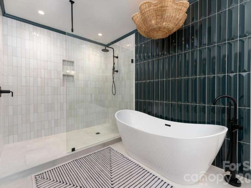 58 Bird Creek Estates Road, Black Mountain, NC 28711.  MLS# CAR4427379, YatesRealty ID 52383. Lower Level Suite Bathroom