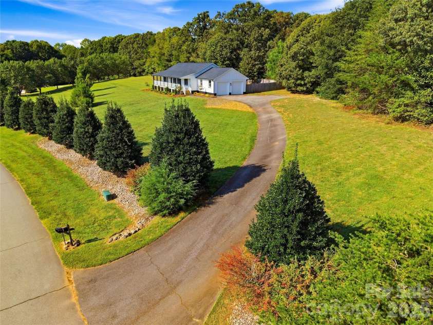 170 Countrytyme Lane, Iron Station, NC 28080.  MLS# CAR4426755, YatesRealty ID 52390. Driveway side