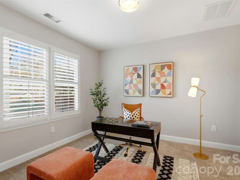 400 Clarice Avenue, Charlotte, NC 28204.  MLS# CAR4356647, YatesRealty ID 5244. Back downstairs. The lower level opens up in ways most condos in this price range simply don't.