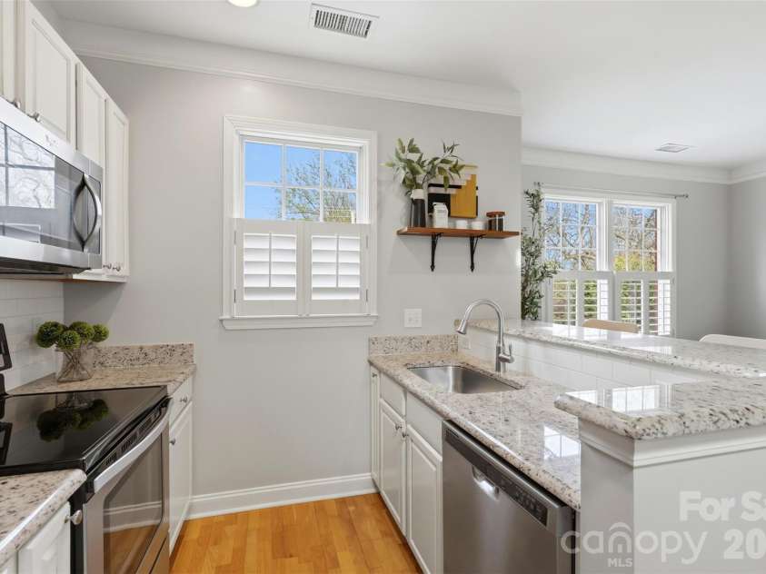 400 Clarice Avenue, Charlotte, NC 28204.  MLS# CAR4356647, YatesRealty ID 5244. Granite, clean lines, storage that makes sense. This floor delivers.