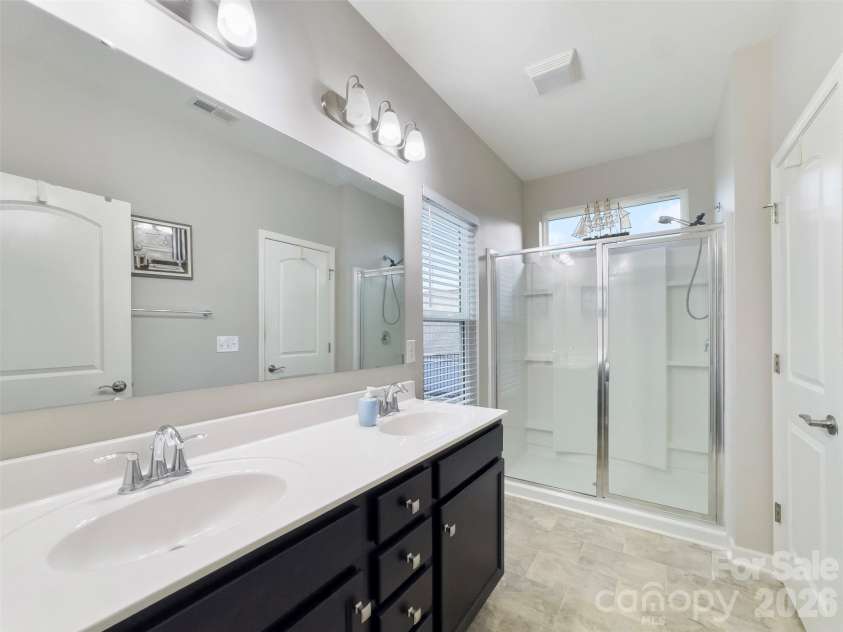 60119 Blue Bird Lane, Lancaster, SC 29720.  MLS# CAR4426158, YatesRealty ID 52441. Primary bedroom with dual vanity sinks