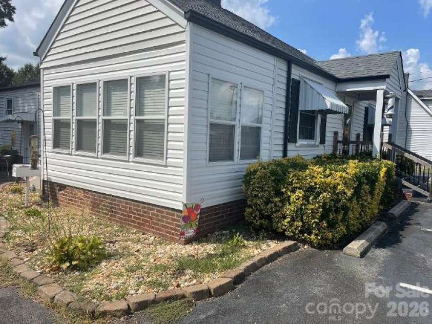 1670 Dale Earnhardt Boulevard, Kannapolis, NC 28083.  MLS# CAR4427144, YatesRealty ID 52443. House Left Front View & Sunroom