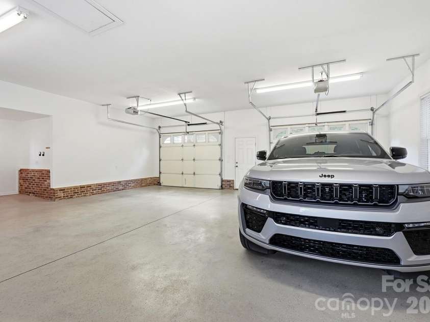5881 Highway 557 Highway, Lake Wylie, SC 29710.  MLS# CAR4426749, YatesRealty ID 52449. Oversized garage attached to the house.