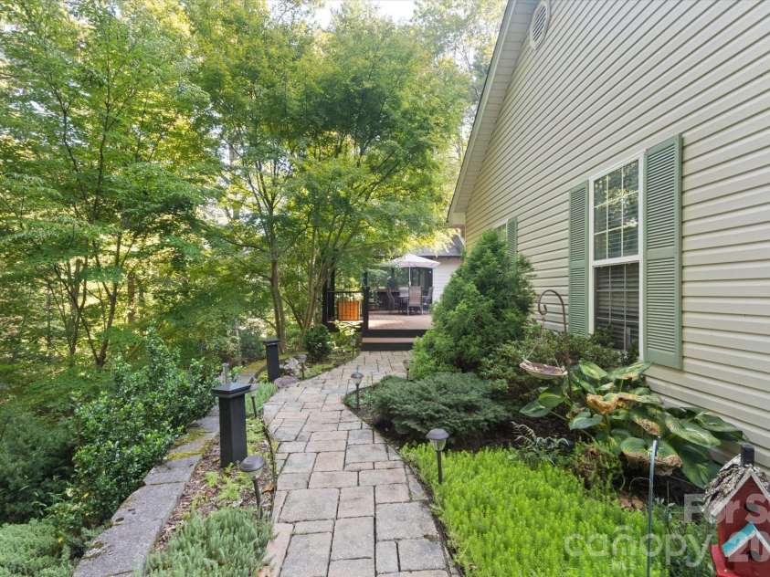 300 Caroline Lane, Pisgah Forest, NC 28768.  MLS# CAR4426646, YatesRealty ID 52453. Charming stone walkway from driveway.