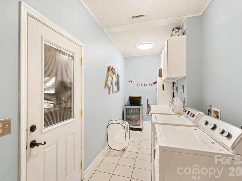 300 Caroline Lane, Pisgah Forest, NC 28768.  MLS# CAR4426646, YatesRealty ID 52453. Large laundry room