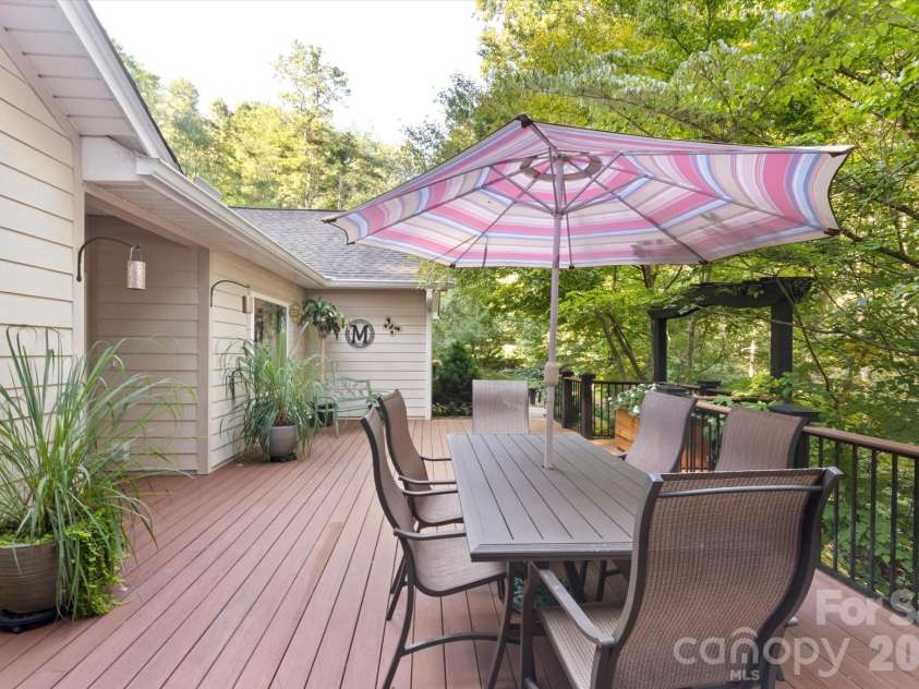 300 Caroline Lane, Pisgah Forest, NC 28768.  MLS# CAR4426646, YatesRealty ID 52453. Room for entertaining on front deck