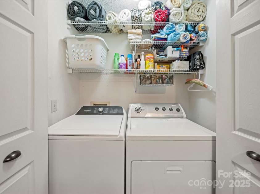 12708 Hollyhock Lane, Huntersville, NC 28078.  MLS# CAR4241322, YatesRealty ID 5246. Laundry Closet in Powder Room