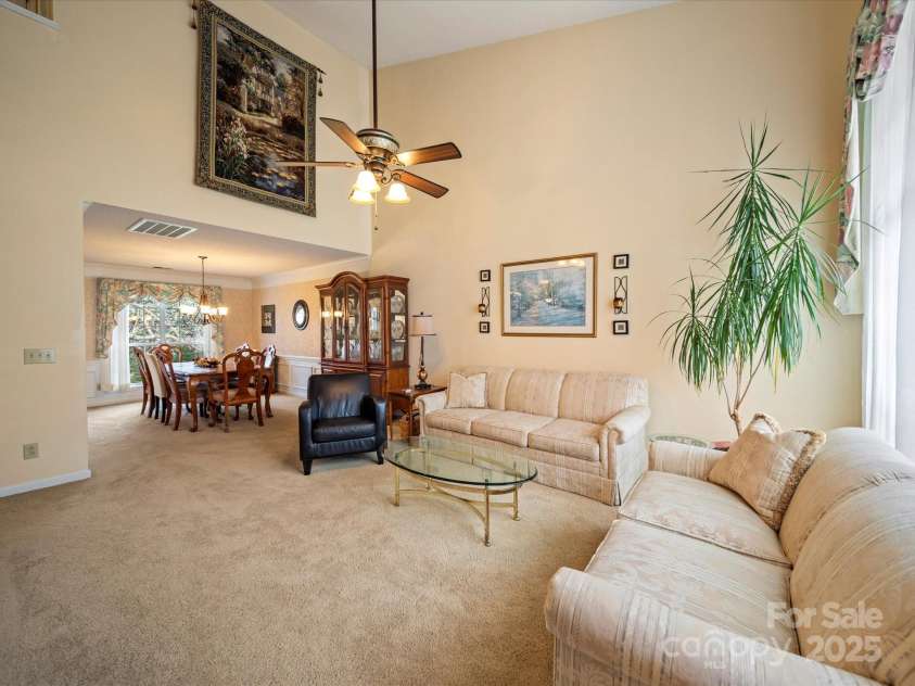 12708 Hollyhock Lane, Huntersville, NC 28078.  MLS# CAR4241322, YatesRealty ID 5246. Living Room and Dining Room From Foyer