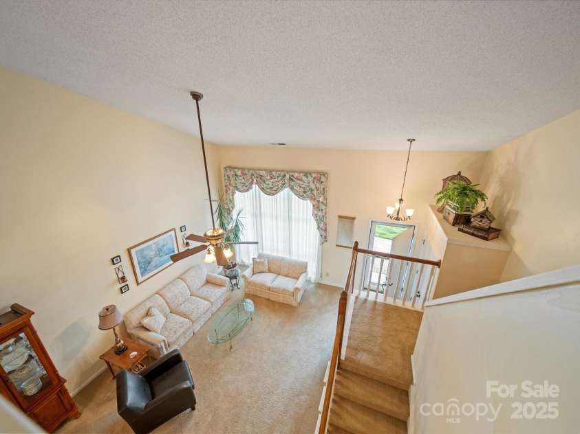 12708 Hollyhock Lane, Huntersville, NC 28078.  MLS# CAR4241322, YatesRealty ID 5246. Living Room from Second Floor Landing