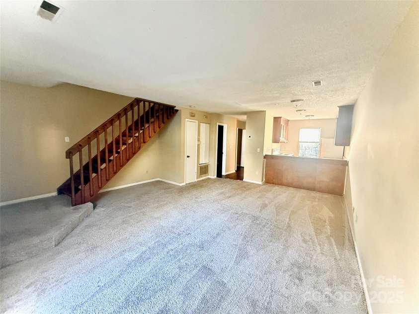 3959 Briarhill Drive, Charlotte, NC 28215.  MLS# CAR4214956, YatesRealty ID 5247. Living Room and Kitchen