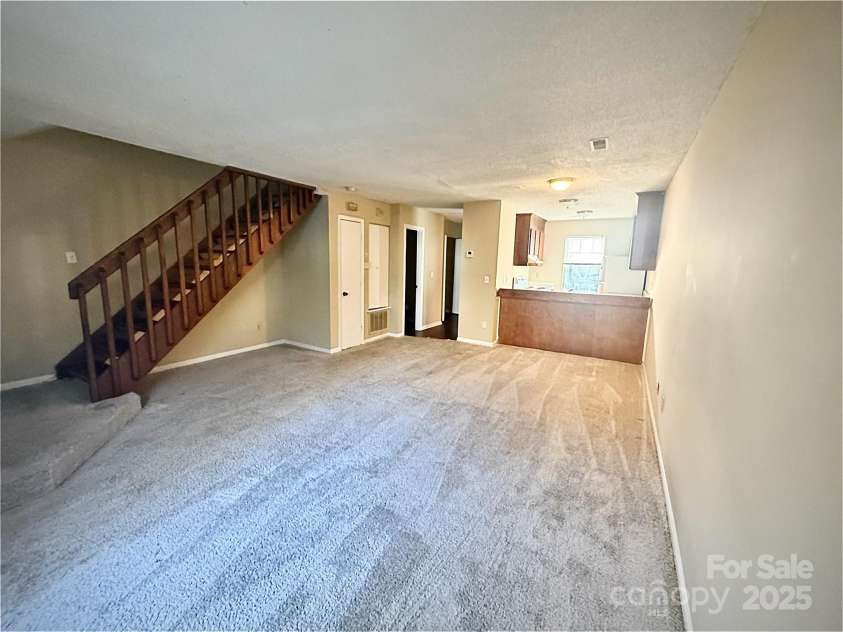 3959 Briarhill Drive, Charlotte, NC 28215.  MLS# CAR4214956, YatesRealty ID 5247. Living Room and Kitchen