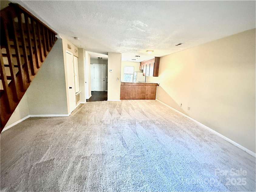3959 Briarhill Drive, Charlotte, NC 28215.  MLS# CAR4214956, YatesRealty ID 5247. Living Room and Kitchen
