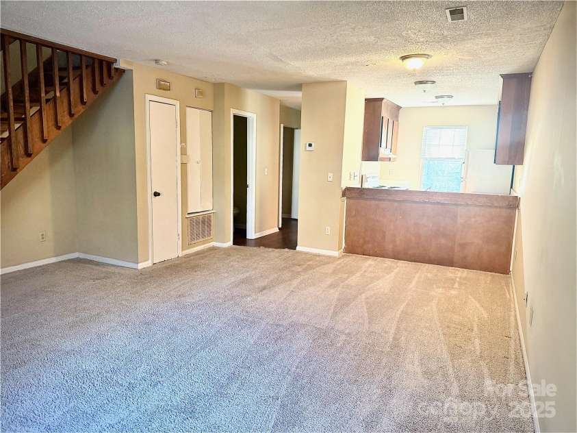 3959 Briarhill Drive, Charlotte, NC 28215.  MLS# CAR4214956, YatesRealty ID 5247. Living Room and Kitchen