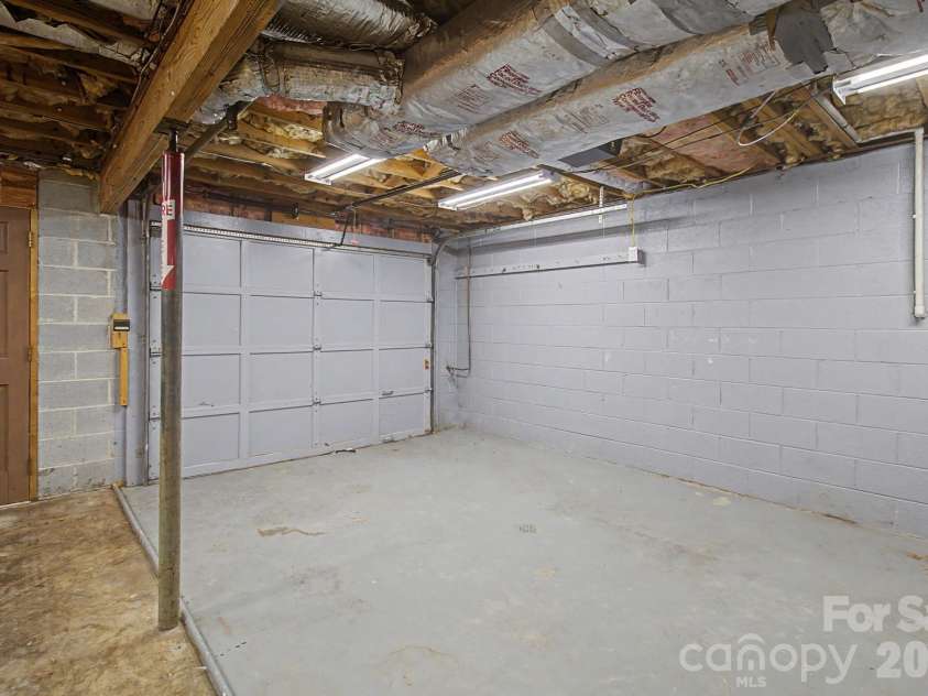 21 Coffey Circle, Asheville, NC 28806.  MLS# CAR4424466, YatesRealty ID 52488. 1 space pull in garage