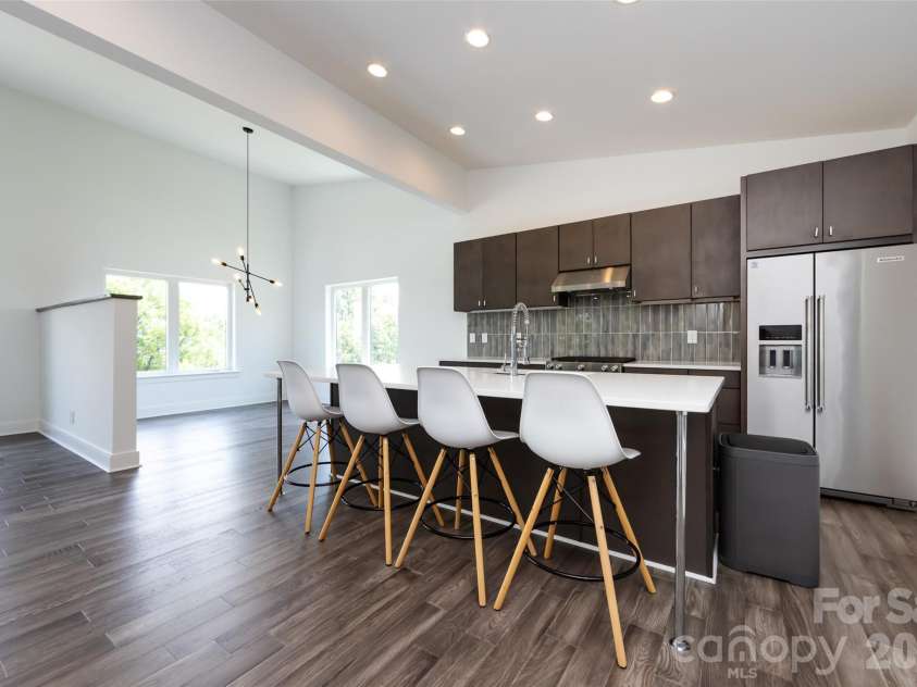 232 Flint Street, Charlotte, NC 28216.  MLS# CAR4425709, YatesRealty ID 52507. Living, Kitchen, Dining 3rd Floor with island