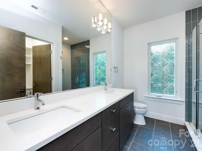 232 Flint Street, Charlotte, NC 28216.  MLS# CAR4425709, YatesRealty ID 52507. Primary Bathroom 2nd floor
