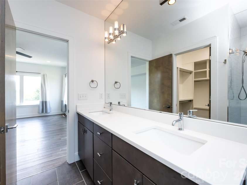232 Flint Street, Charlotte, NC 28216.  MLS# CAR4425709, YatesRealty ID 52507. Primary bathroom 2nd floor ensuite