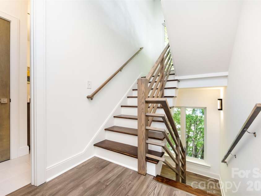 232 Flint Street, Charlotte, NC 28216.  MLS# CAR4425709, YatesRealty ID 52507. Staircase with landing