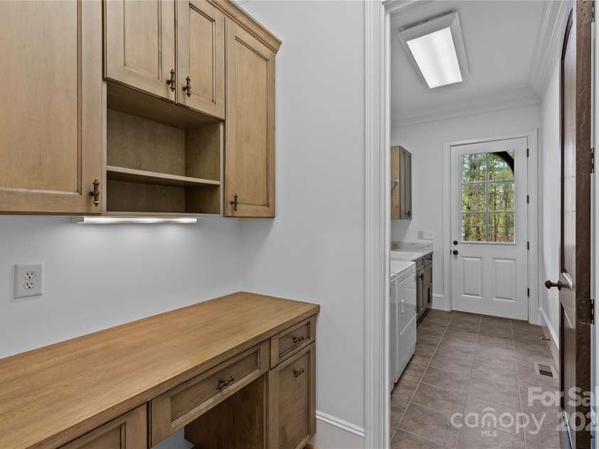 304 Ivy Springs Lane, Waxhaw, NC 28173.  MLS# CAR4239863, YatesRealty ID 5251. Desk area and 1 of 2 laundry rooms