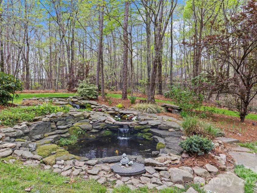 304 Ivy Springs Lane, Waxhaw, NC 28173.  MLS# CAR4239863, YatesRealty ID 5251. Koi Pond