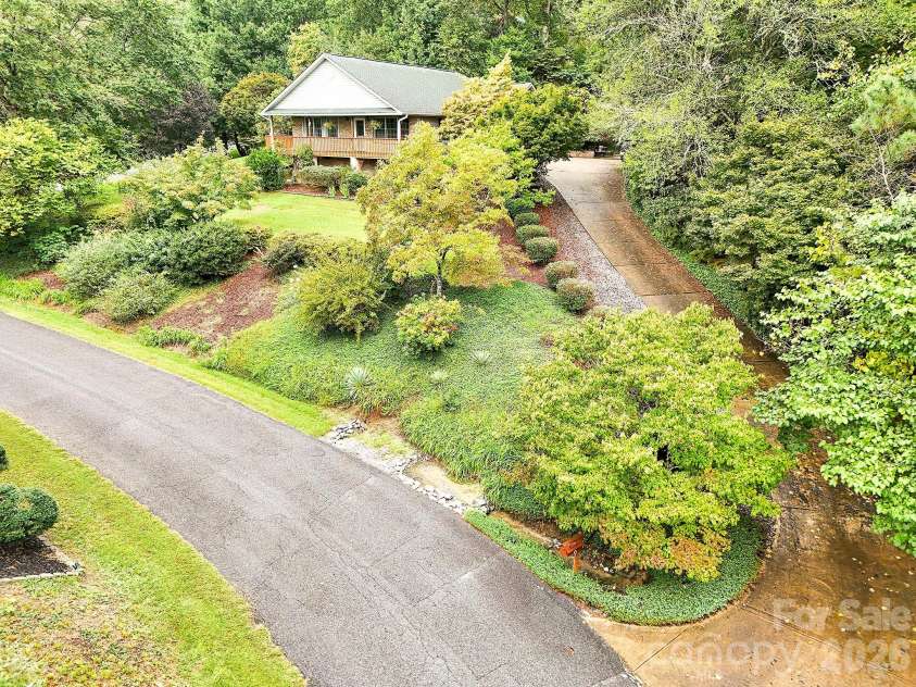 2008 Deep Woods Drive, Hendersonville, NC 28739.  MLS# CAR4424747, YatesRealty ID 52522. Elevated front view, mature landscaping.