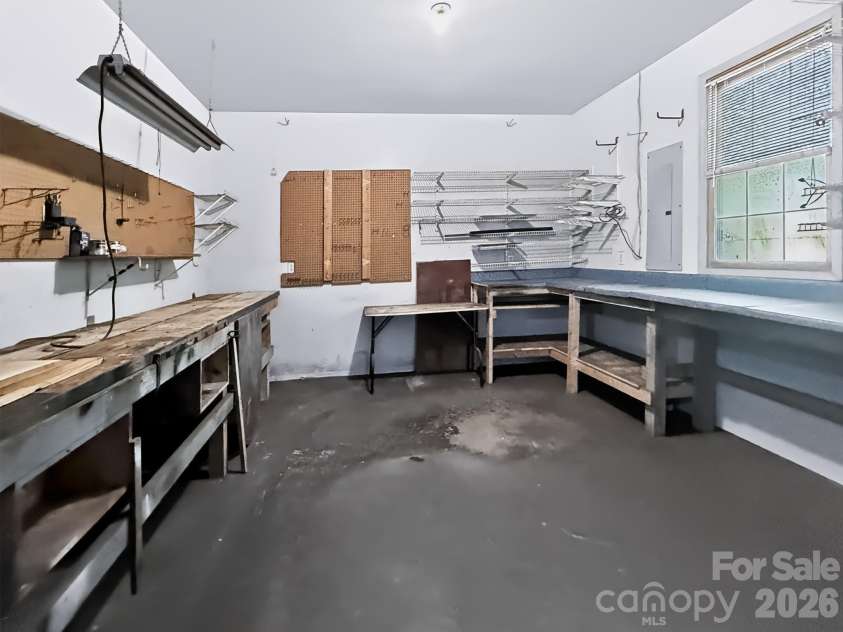 2008 Deep Woods Drive, Hendersonville, NC 28739.  MLS# CAR4424747, YatesRealty ID 52522. Workshop in the garage.