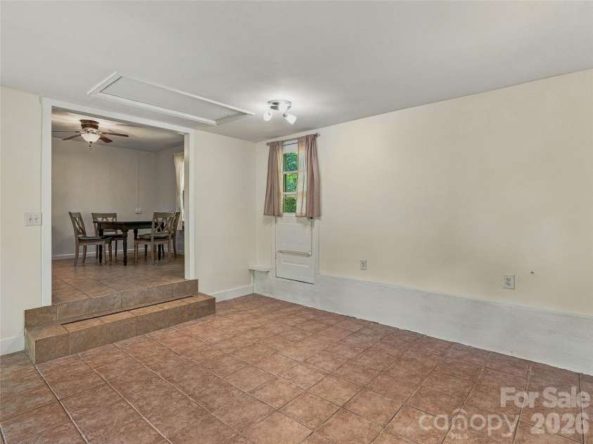 65 Passional Way, Burnsville, NC 28714.  MLS# CAR4427179, YatesRealty ID 52526. Porch off kitchen