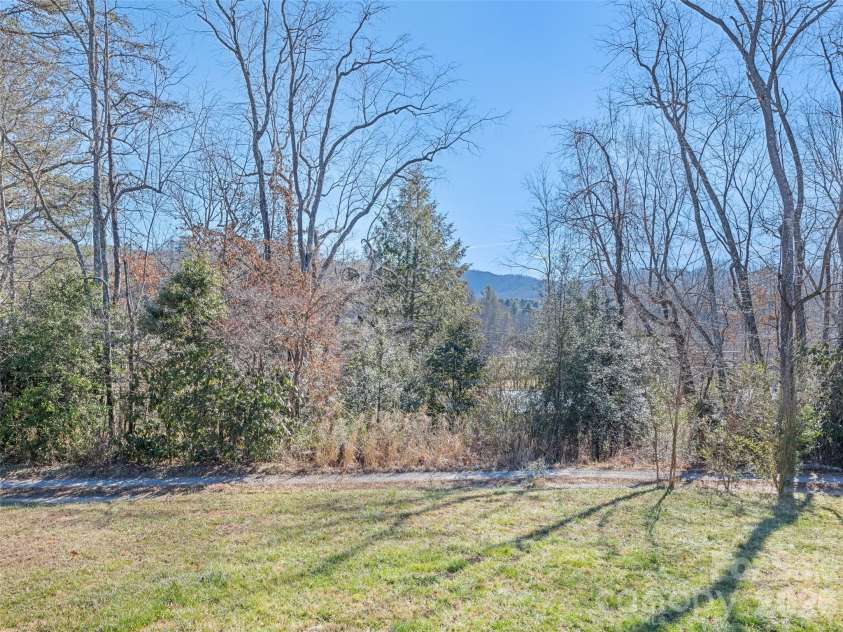 10 Enochs Way, Fletcher, NC 28732.  MLS# CAR4333141, YatesRealty ID 5253. Side Yard Mountain Views