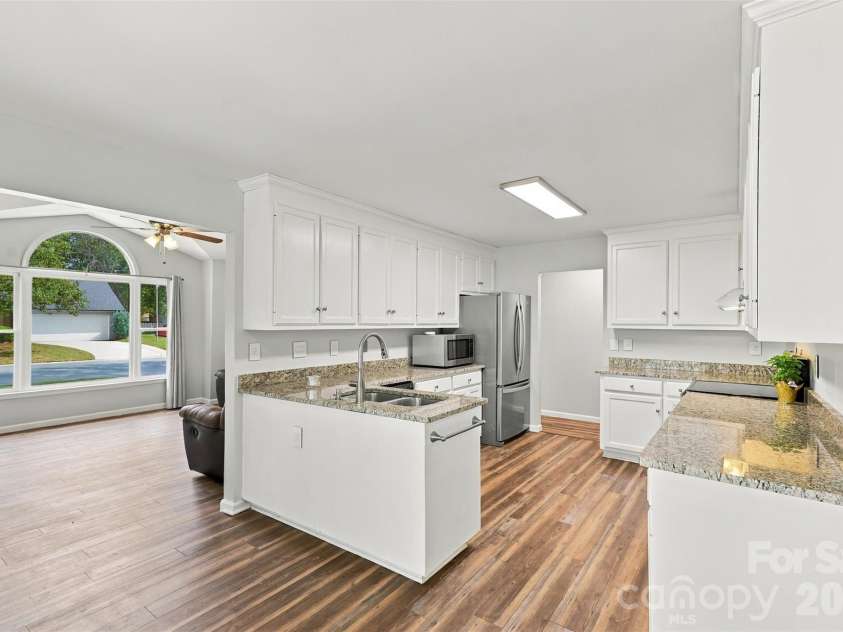 3000 Faircroft Way, Monroe, NC 28110.  MLS# CAR4427543, YatesRealty ID 52533. Kitchen- updated cabinets & updated granite