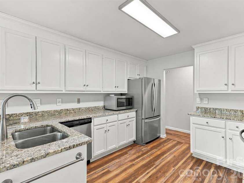 3000 Faircroft Way, Monroe, NC 28110.  MLS# CAR4427543, YatesRealty ID 52533. Kitchen- updated cabinets & updated granite