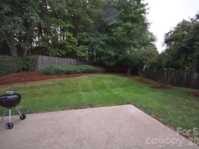 3703 Sipes Lane, Charlotte, NC 28269.  MLS# CAR4427150, YatesRealty ID 52548. Concrete patio in back yard