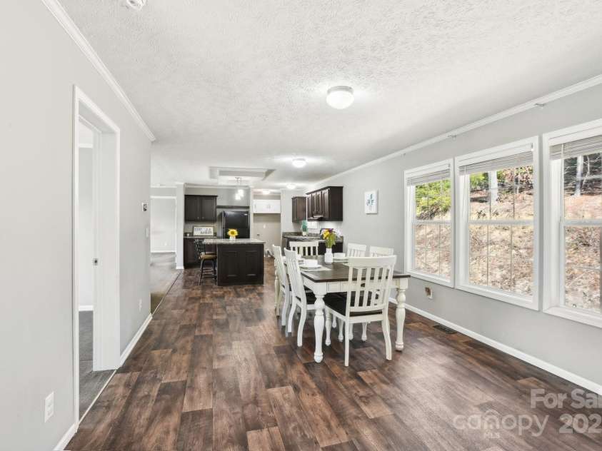 296 Sentelle Lane, Hendersonville, NC 28739.  MLS# CAR4226674, YatesRealty ID 5255. Dining area looking into kitchen