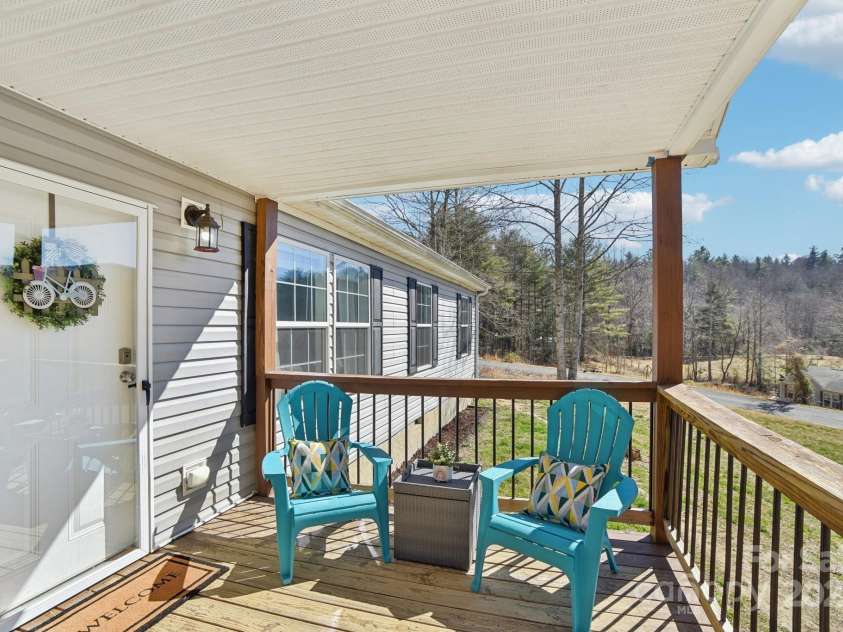 296 Sentelle Lane, Hendersonville, NC 28739.  MLS# CAR4226674, YatesRealty ID 5255. Lovely covered front porch ideal