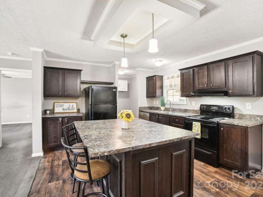 296 Sentelle Lane, Hendersonville, NC 28739.  MLS# CAR4226674, YatesRealty ID 5255. Spacious kitchen island complete with breakfast bar