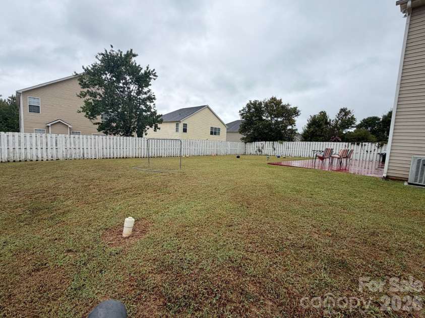 6603 Burkwood Court, Harrisburg, NC 28075.  MLS# CAR4427769, YatesRealty ID 52552. Back yard
