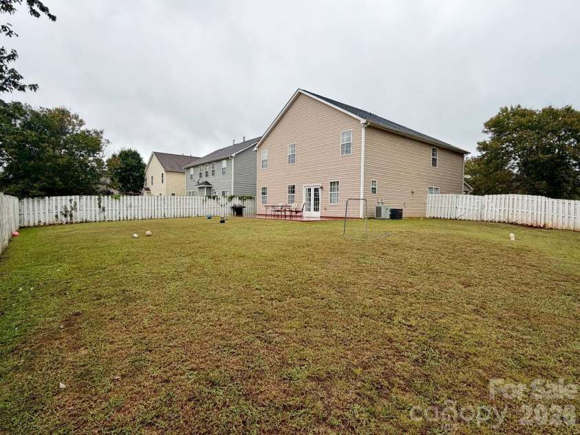 6603 Burkwood Court, Harrisburg, NC 28075.  MLS# CAR4427769, YatesRealty ID 52552. Back yard