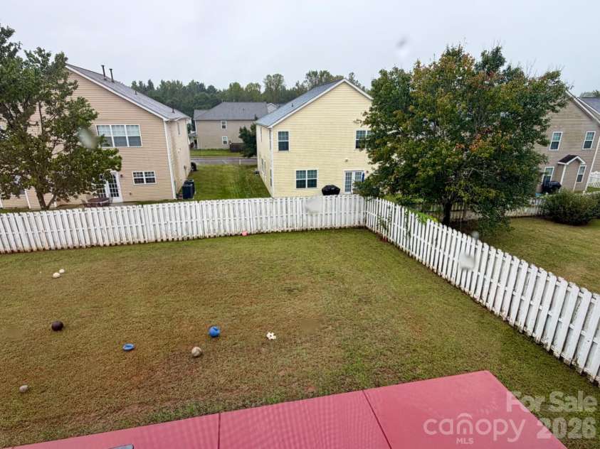 6603 Burkwood Court, Harrisburg, NC 28075.  MLS# CAR4427769, YatesRealty ID 52552. Back yard