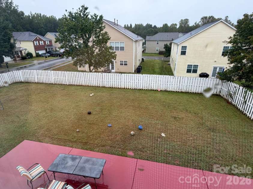 6603 Burkwood Court, Harrisburg, NC 28075.  MLS# CAR4427769, YatesRealty ID 52552. Back yard