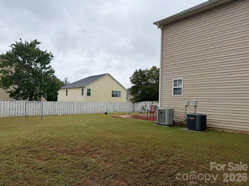 6603 Burkwood Court, Harrisburg, NC 28075.  MLS# CAR4427769, YatesRealty ID 52552. Side/back yard