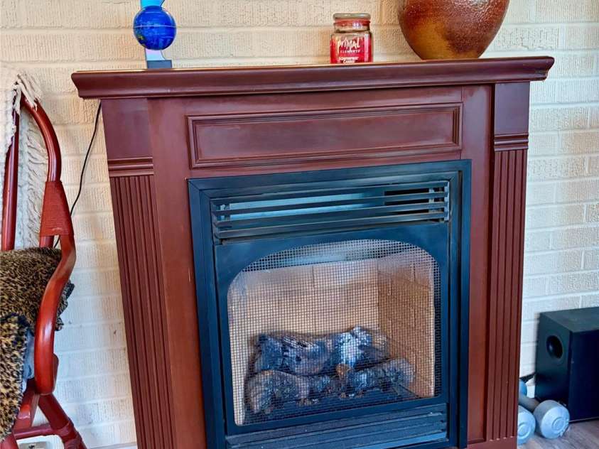 920 Paramount Circle, Gastonia, NC 28052.  MLS# CAR4354209, YatesRealty ID 5257. Gas logs in the sun room.