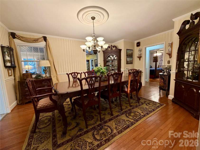 920 Paramount Circle, Gastonia, NC 28052.  MLS# CAR4354209, YatesRealty ID 5257. Generous dining area. Shown with seating for 8 with room to spare.