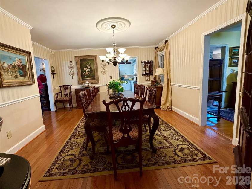 920 Paramount Circle, Gastonia, NC 28052.  MLS# CAR4354209, YatesRealty ID 5257. Generous dining area. Shown with seating for 8 with room to spare.