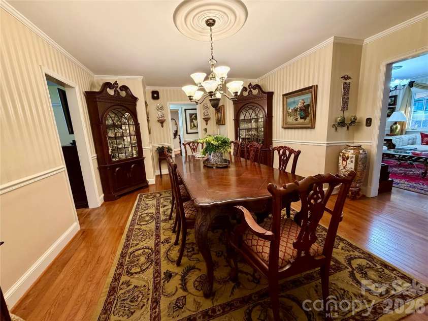 920 Paramount Circle, Gastonia, NC 28052.  MLS# CAR4354209, YatesRealty ID 5257. Generous dining area. Shown with seating for 8 with room to spare.