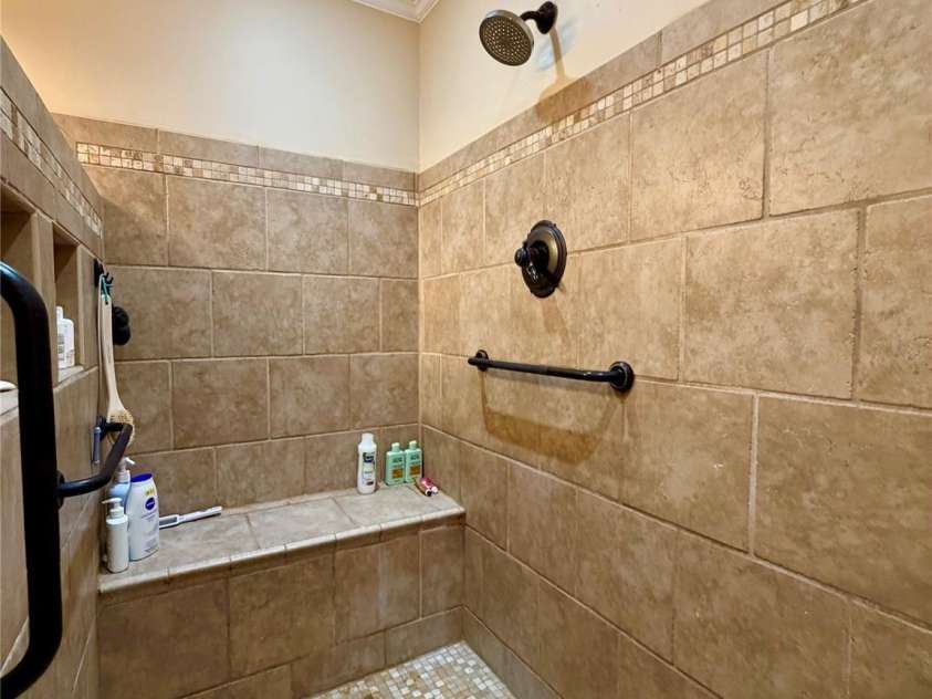 920 Paramount Circle, Gastonia, NC 28052.  MLS# CAR4354209, YatesRealty ID 5257. Owner's en-suite curtom shower with dual seating.