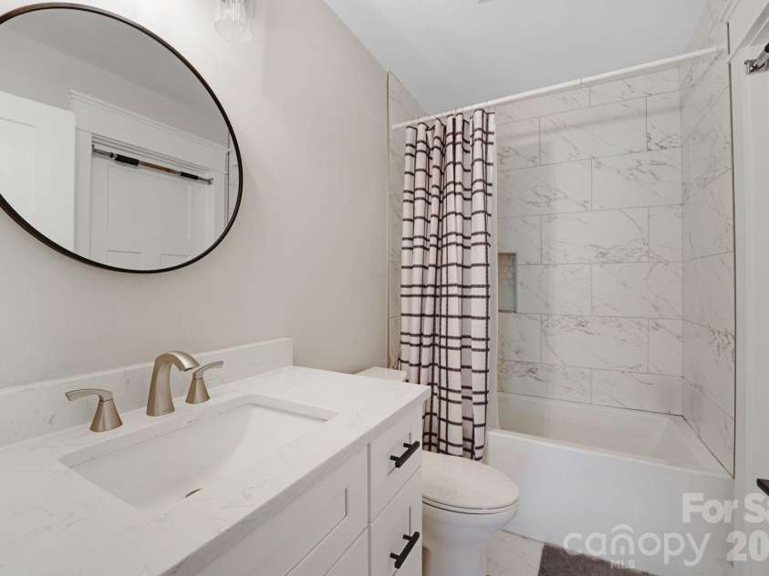 153 Israel Road, Leicester, NC 28748.  MLS# CAR4427403, YatesRealty ID 52573. Main Level Guest Bathroom