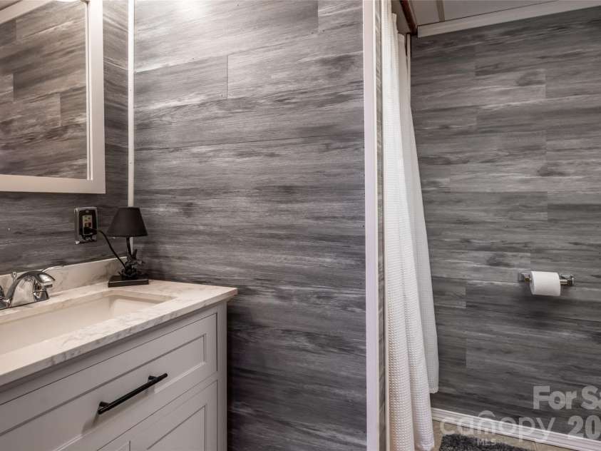 101 Guffey Mountain Road, Fairview, NC 28730.  MLS# CAR4426718, YatesRealty ID 52584. Downstairs  bathroom